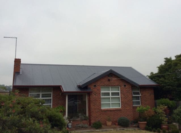 Front view of Balwyn brick home with steel roof