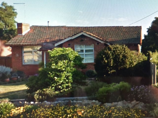 A brick home with tile roof in Balwyn