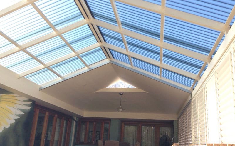 View from beneath a polycarbonate pergola roof