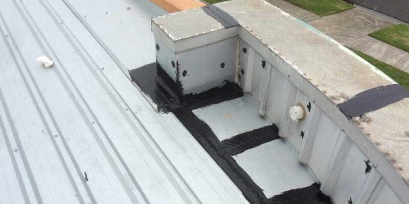 A steel roof with sealant applied to flashings and capping