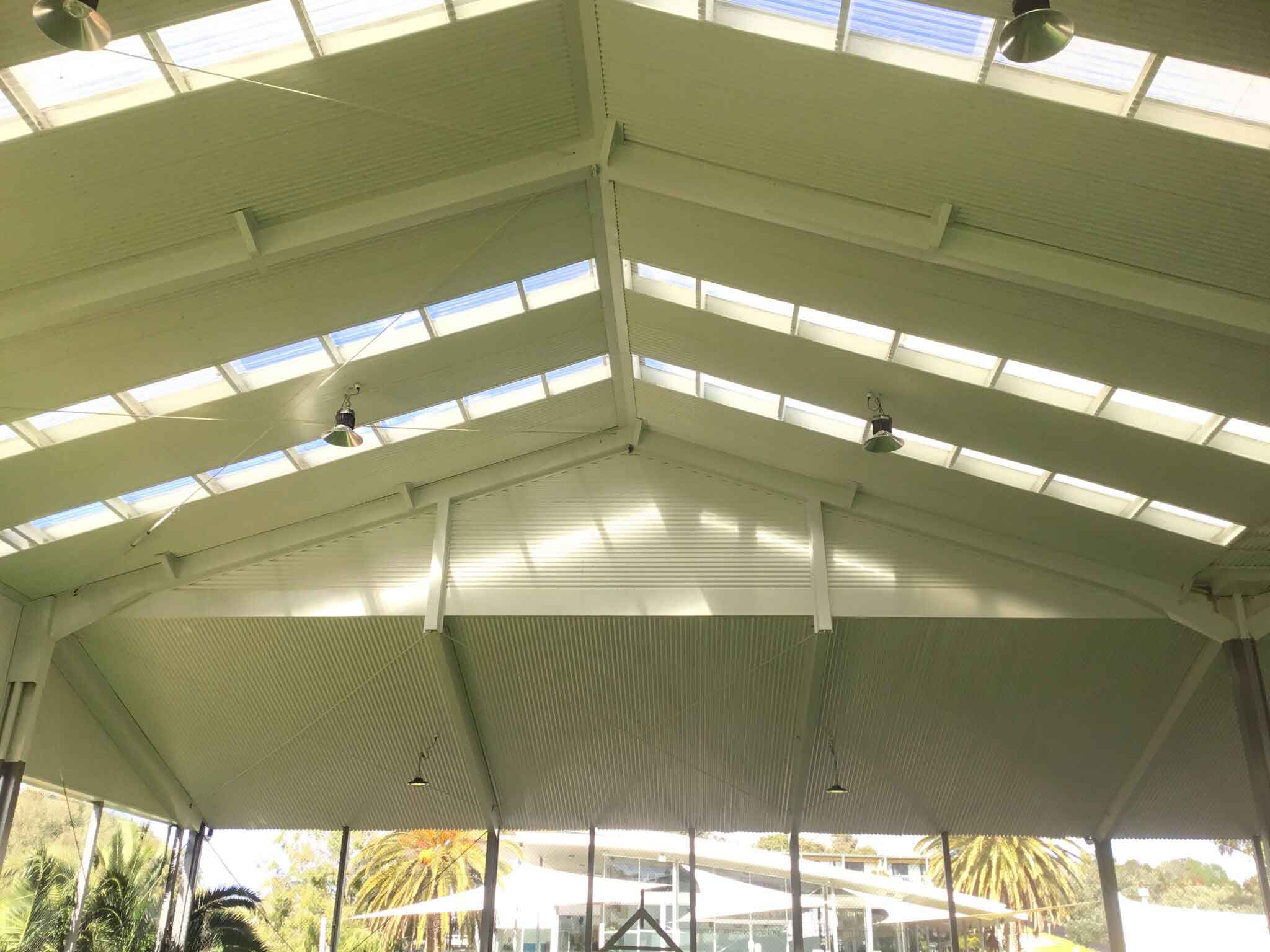 Corrugated wall cladding and flashings installed - Tennis Pavillion (image)