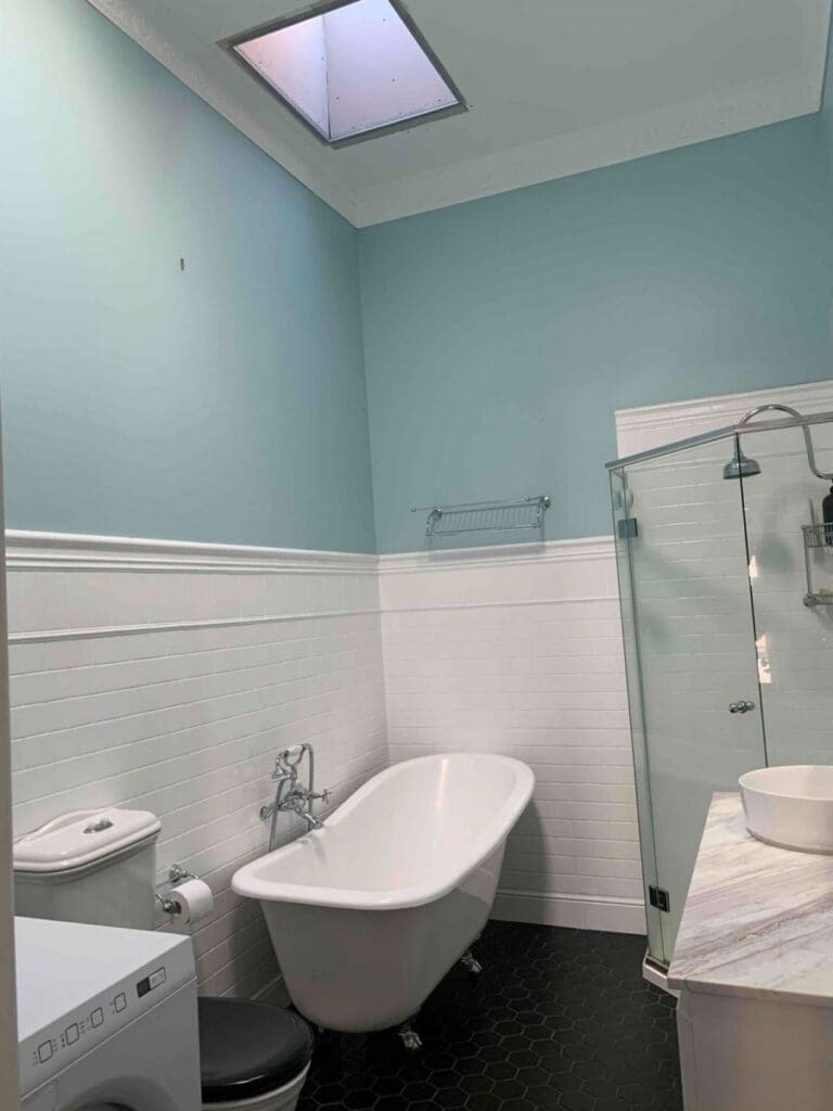 A bathroom with a Velux skylight installed above the bathtub. 